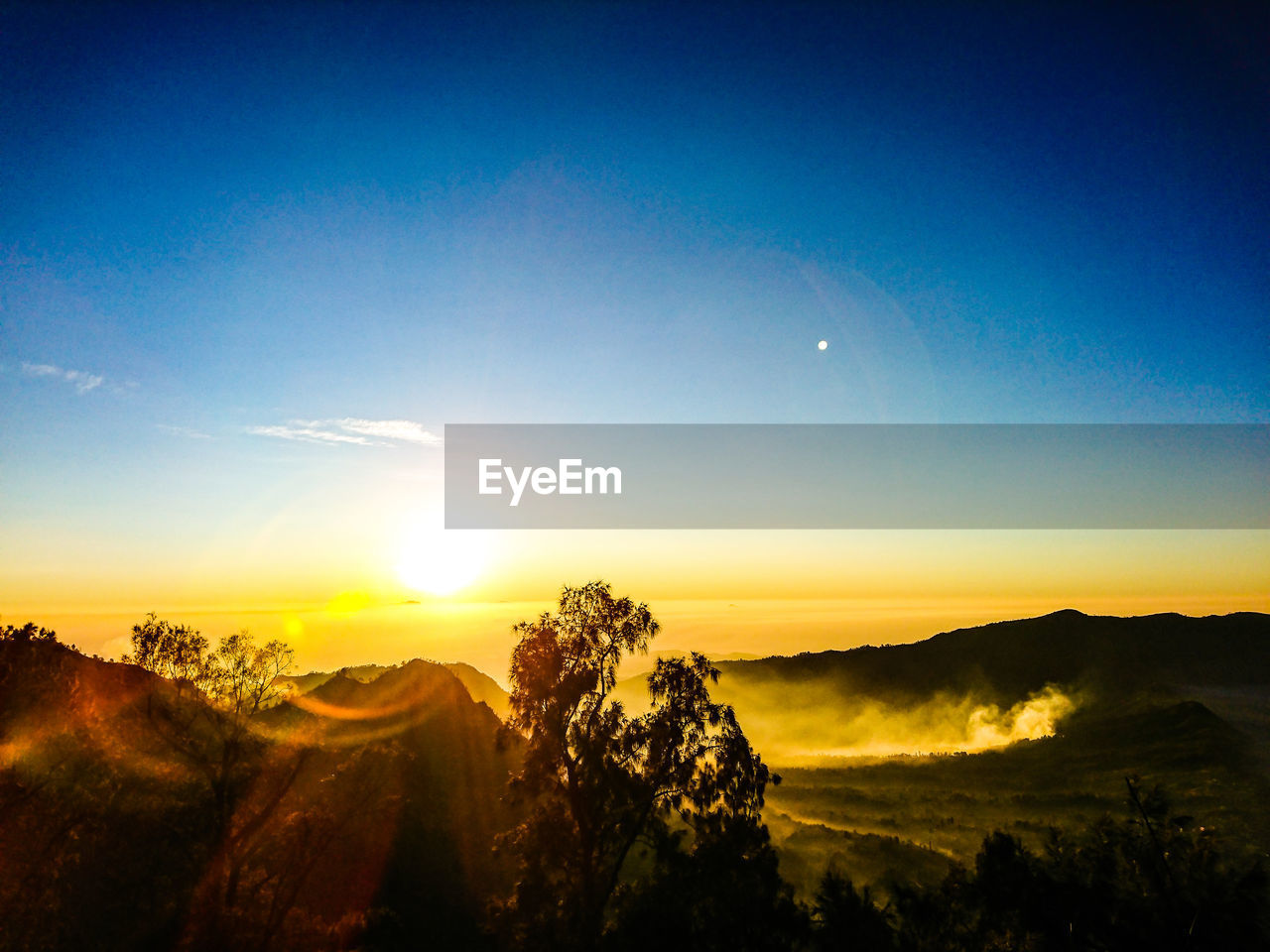 Scenic view of landscape against sky during sunset