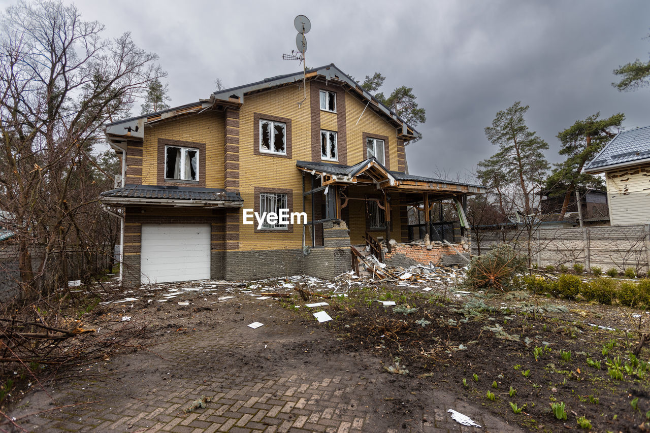 Destroyed buildings on the streets of irpen. broken windows. buildings after being hit by missiles.