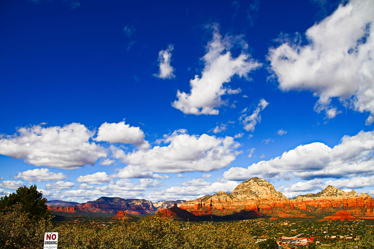 Panoramic view of landscape against blue sky