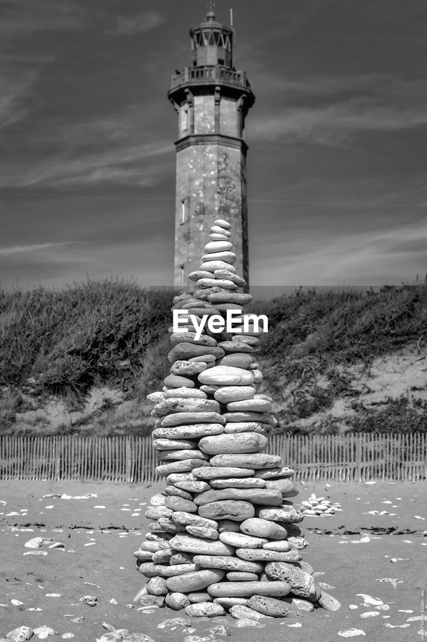 STACK OF STONES AGAINST SKY