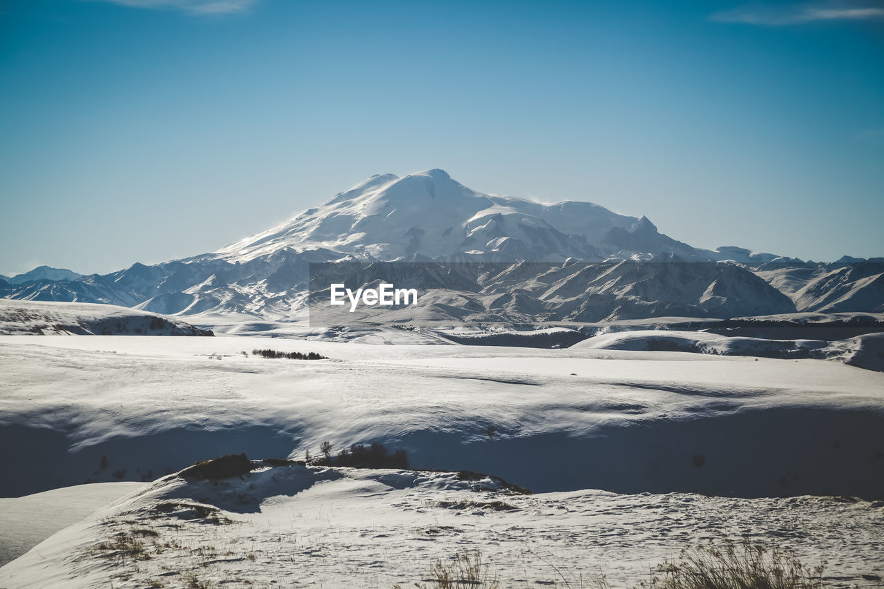 Scenic view of snowcapped mountains against sky. elbrus mountain 