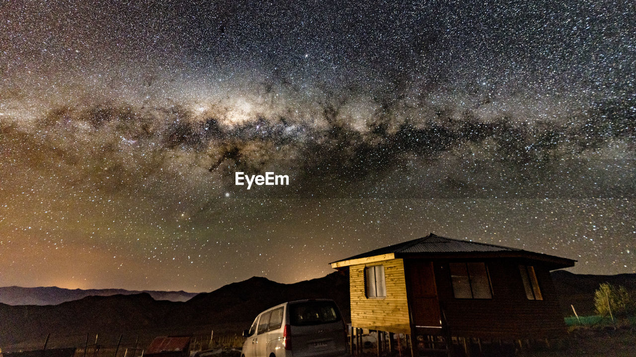 VIEW OF BUILDINGS AGAINST SKY AT NIGHT