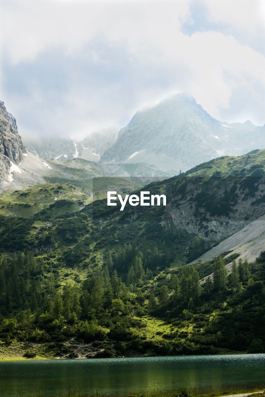 Scenic view of mountains and lake against sky