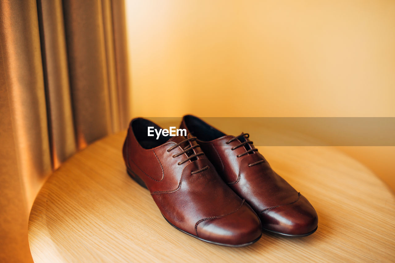 Close-up of shoes on table