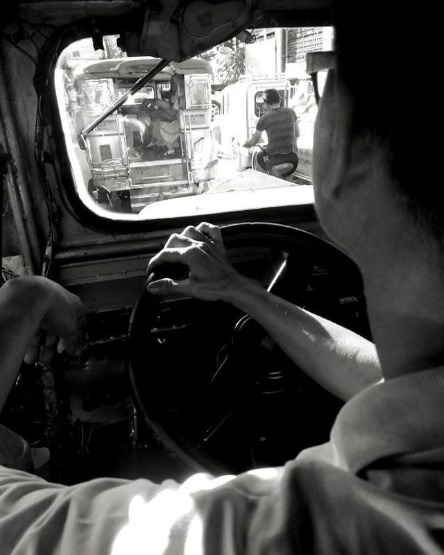 CROPPED IMAGE OF WOMAN TRAVELING IN TRAIN