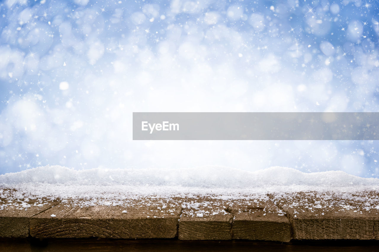 Close-up of snow on wood during winter