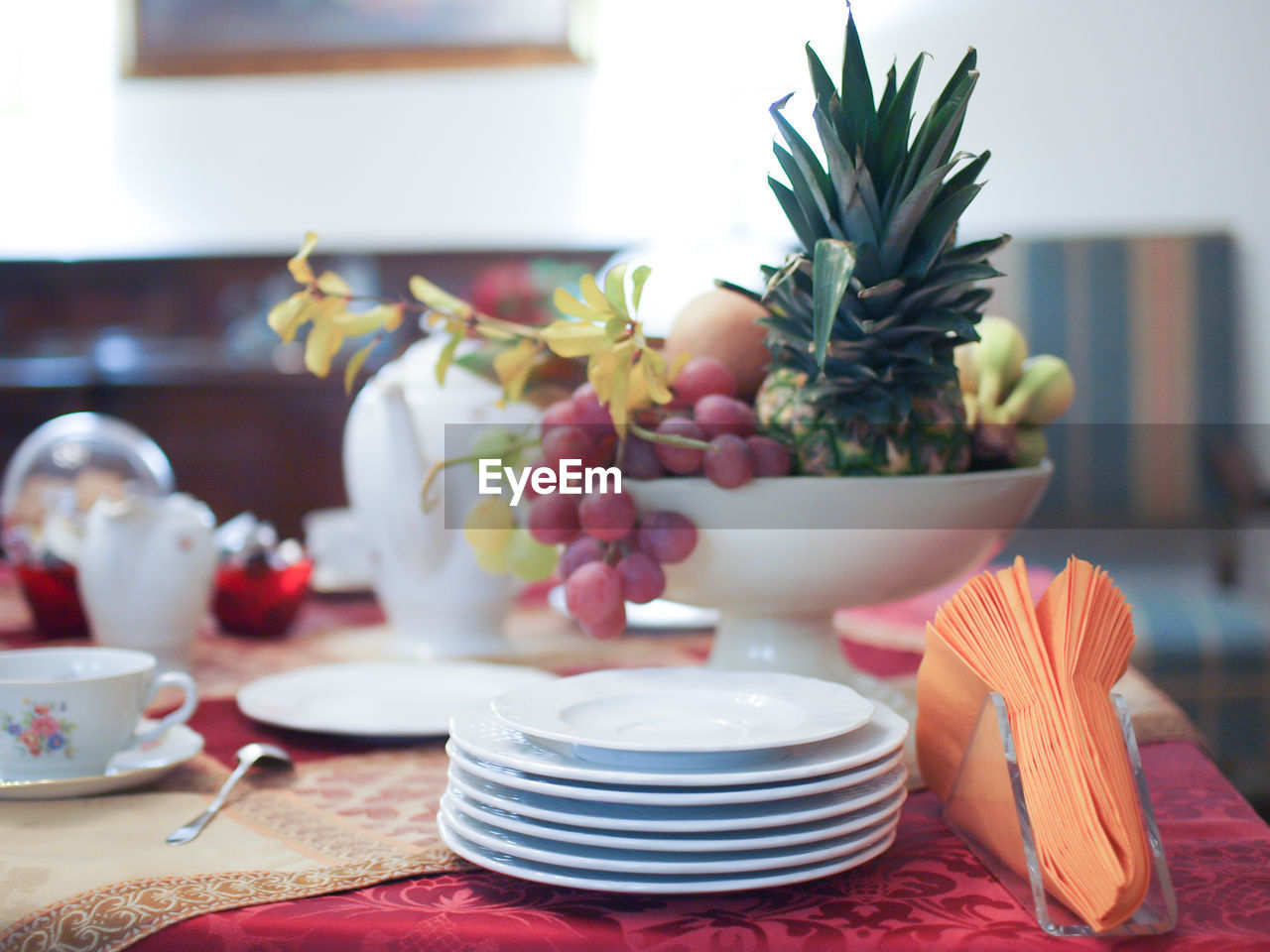 Close-up of fruits in container on table