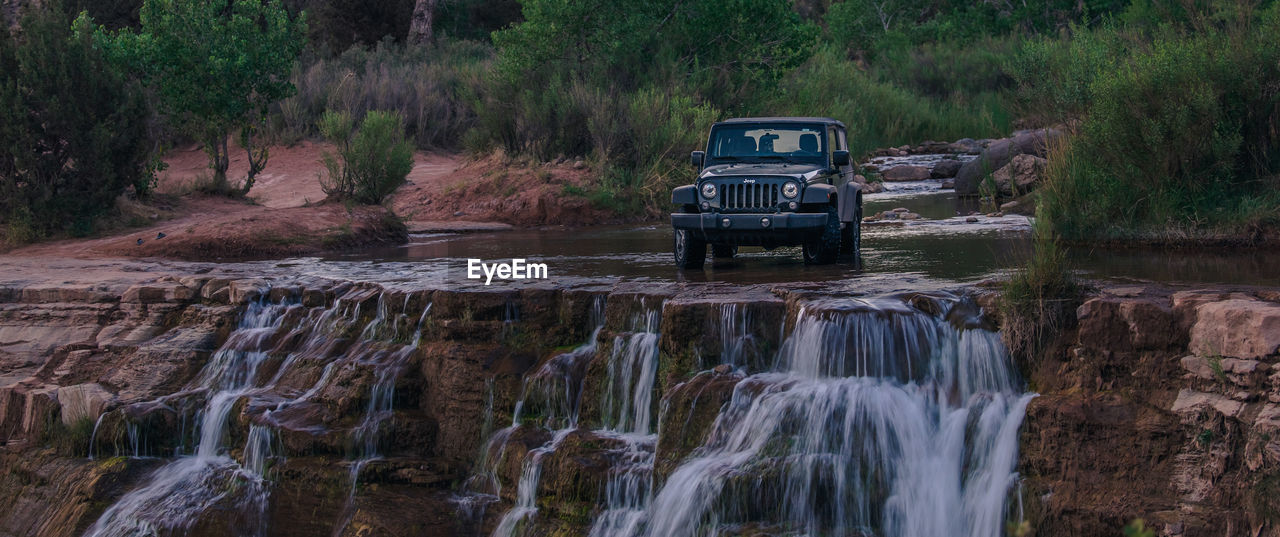 SCENIC VIEW OF WATERFALL