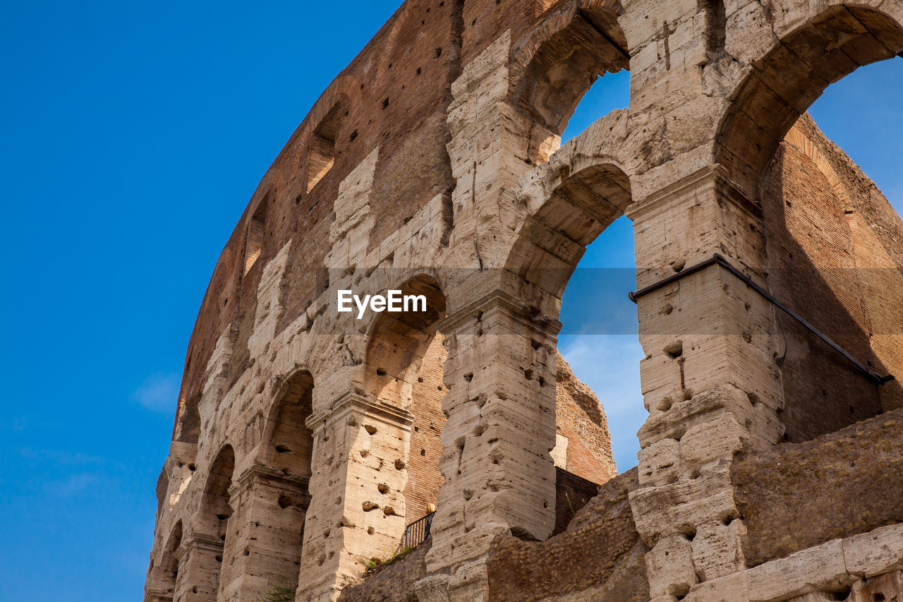 Detail of the facade of the famous colosseum or coliseum also known as the flavian amphitheatre