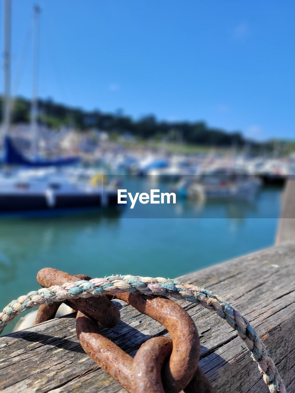 water, day, nature, blue, wood, rope, focus on foreground, nautical vessel, no people, metal, close-up, outdoors, sky, rusty, strength, ship, transportation, sea, sunlight, selective focus, architecture