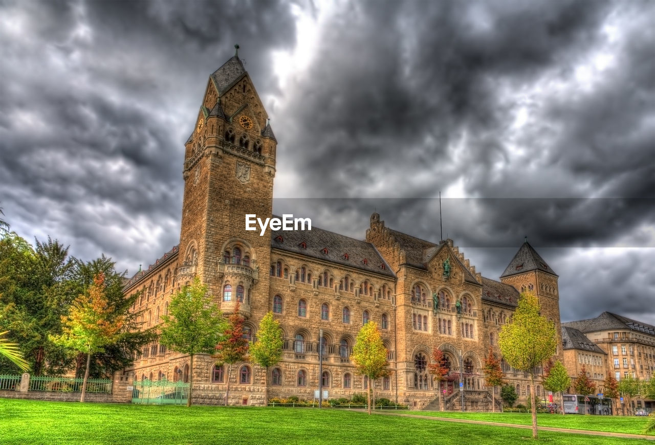 CASTLE AGAINST CLOUDY SKY