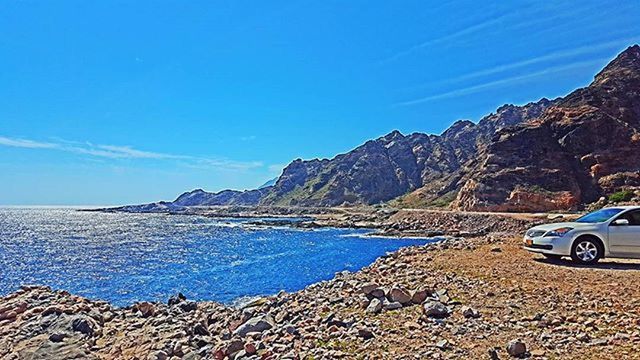 SCENIC VIEW OF SEA AND MOUNTAINS