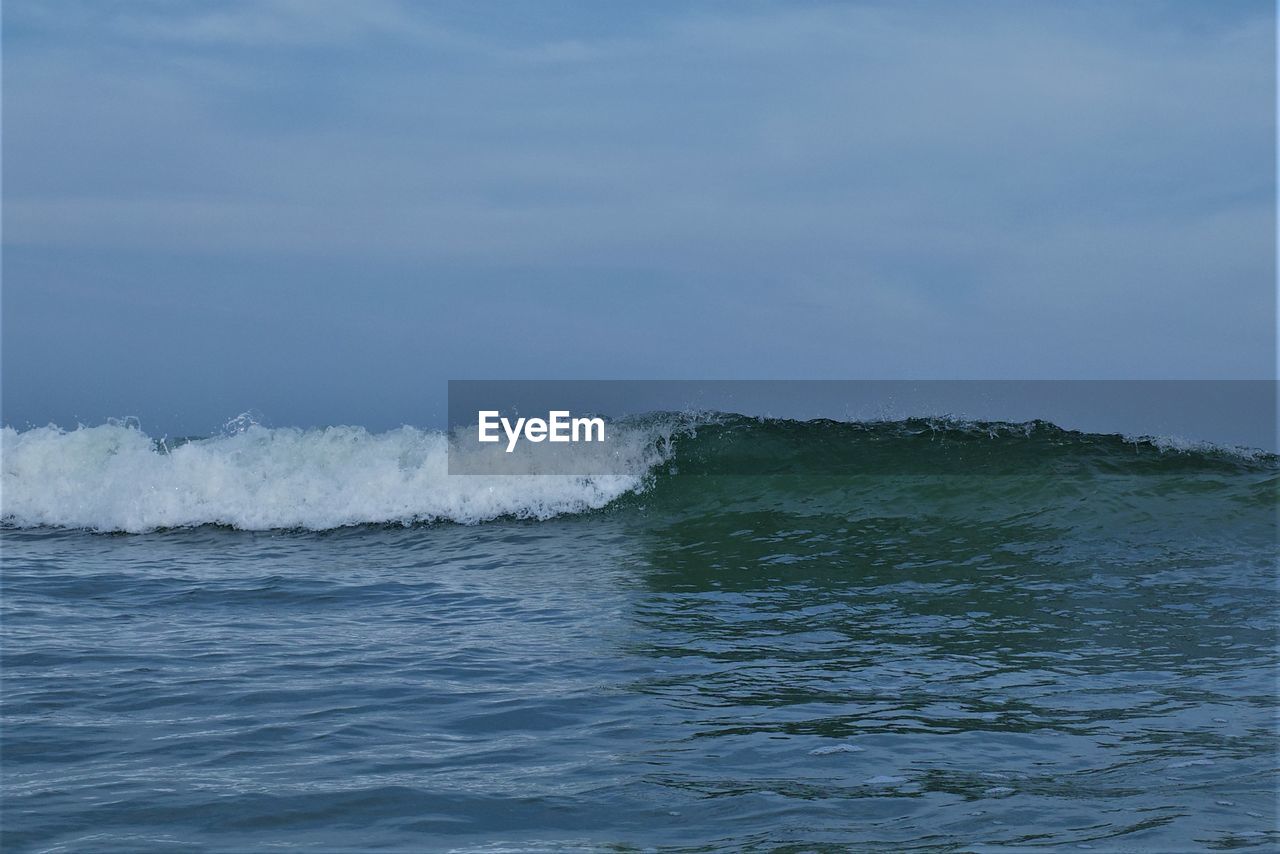 sea, water, ocean, motion, sky, wave, wind wave, beauty in nature, shore, coast, scenics - nature, nature, no people, cloud, horizon, day, waterfront, outdoors, wind, sports, horizon over water, water sports, land, beach, tranquil scene, splashing, power in nature, tranquility