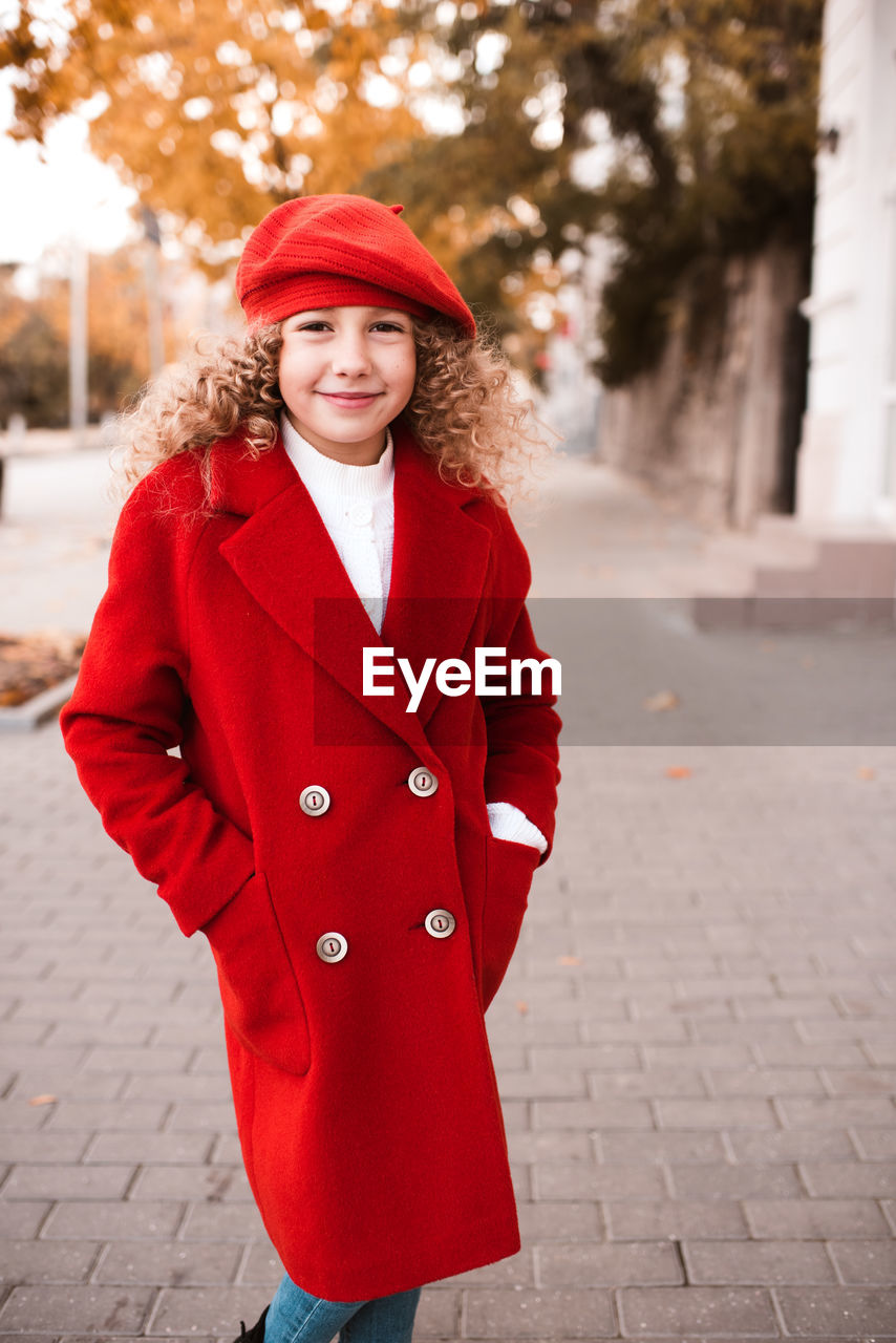 Portrait of girl standing on street