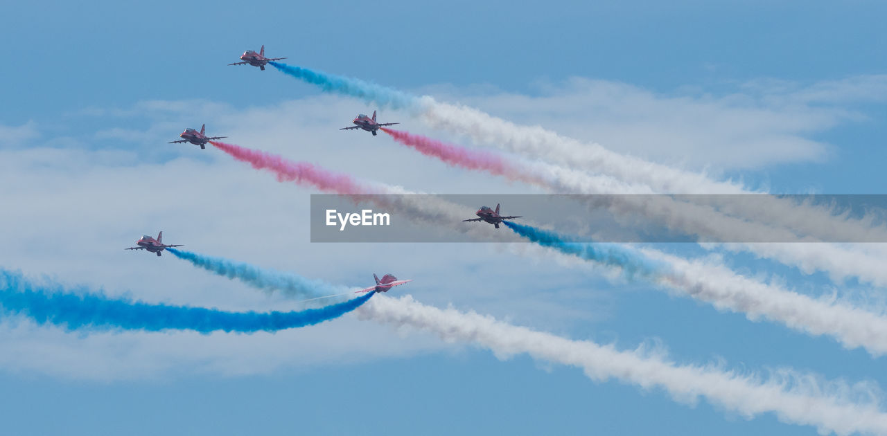 LOW ANGLE VIEW OF AIRSHOW IN SKY