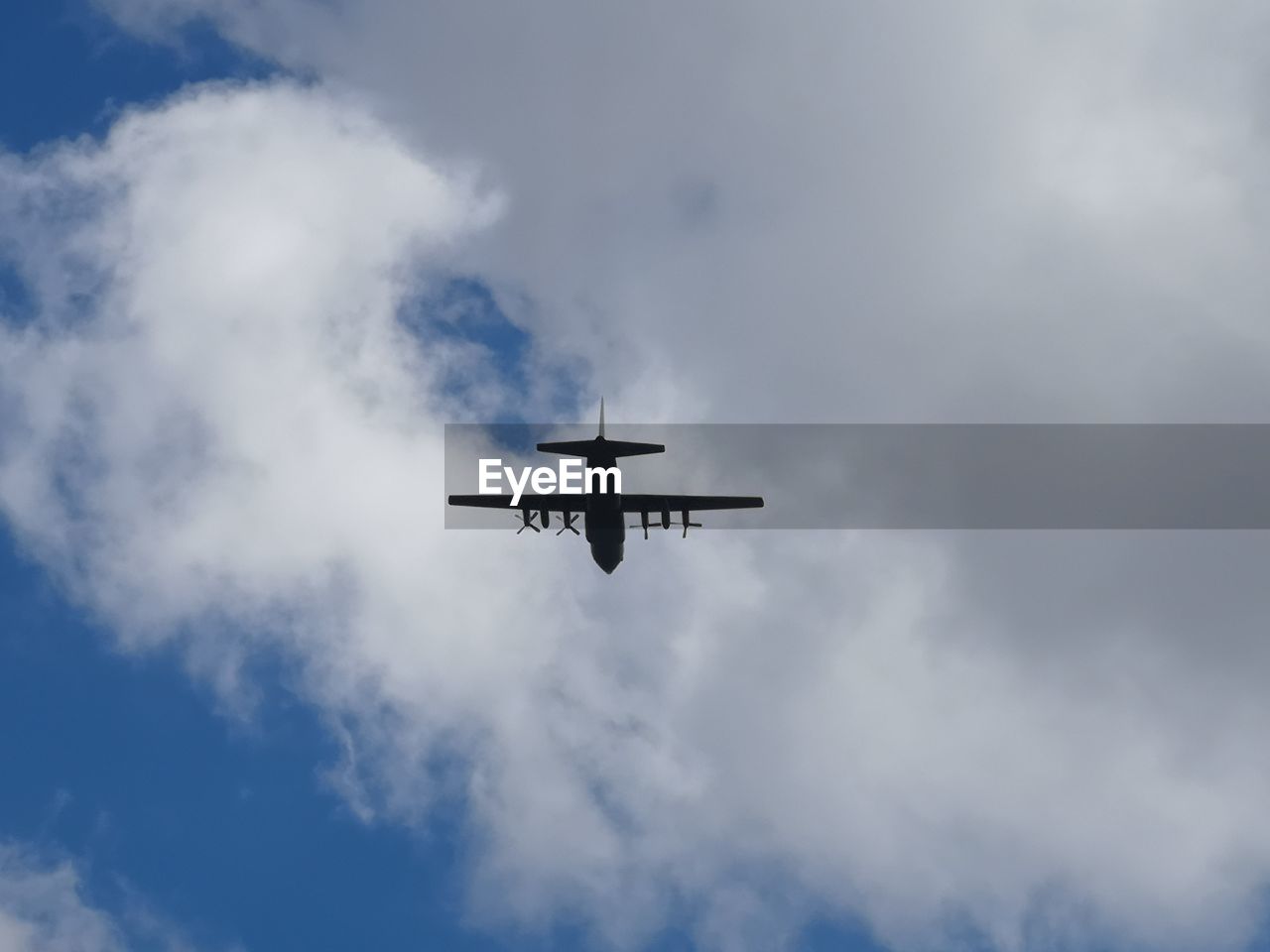 Low angle view of airplane against sky