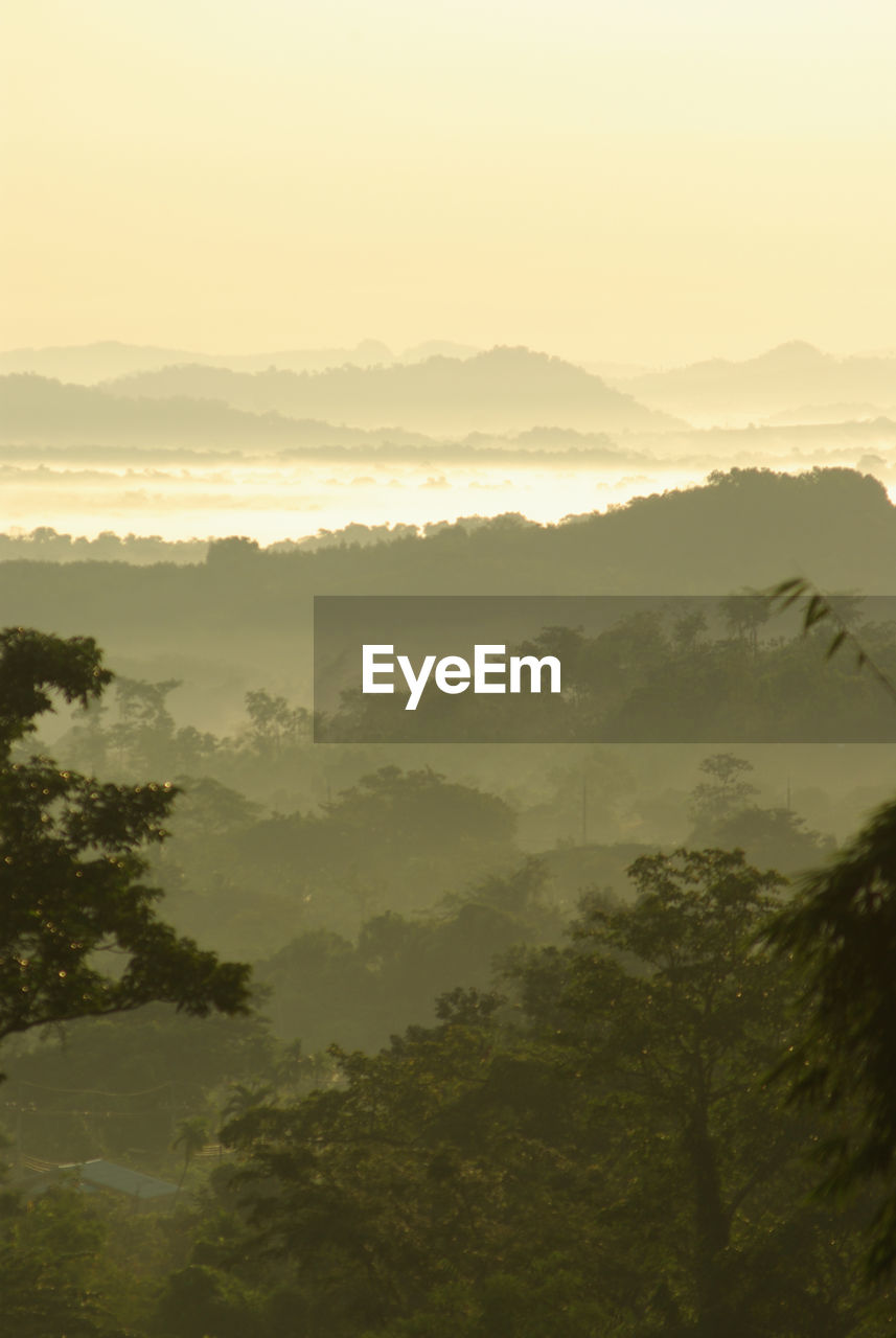 Scenic view of mountains against sky during sunset