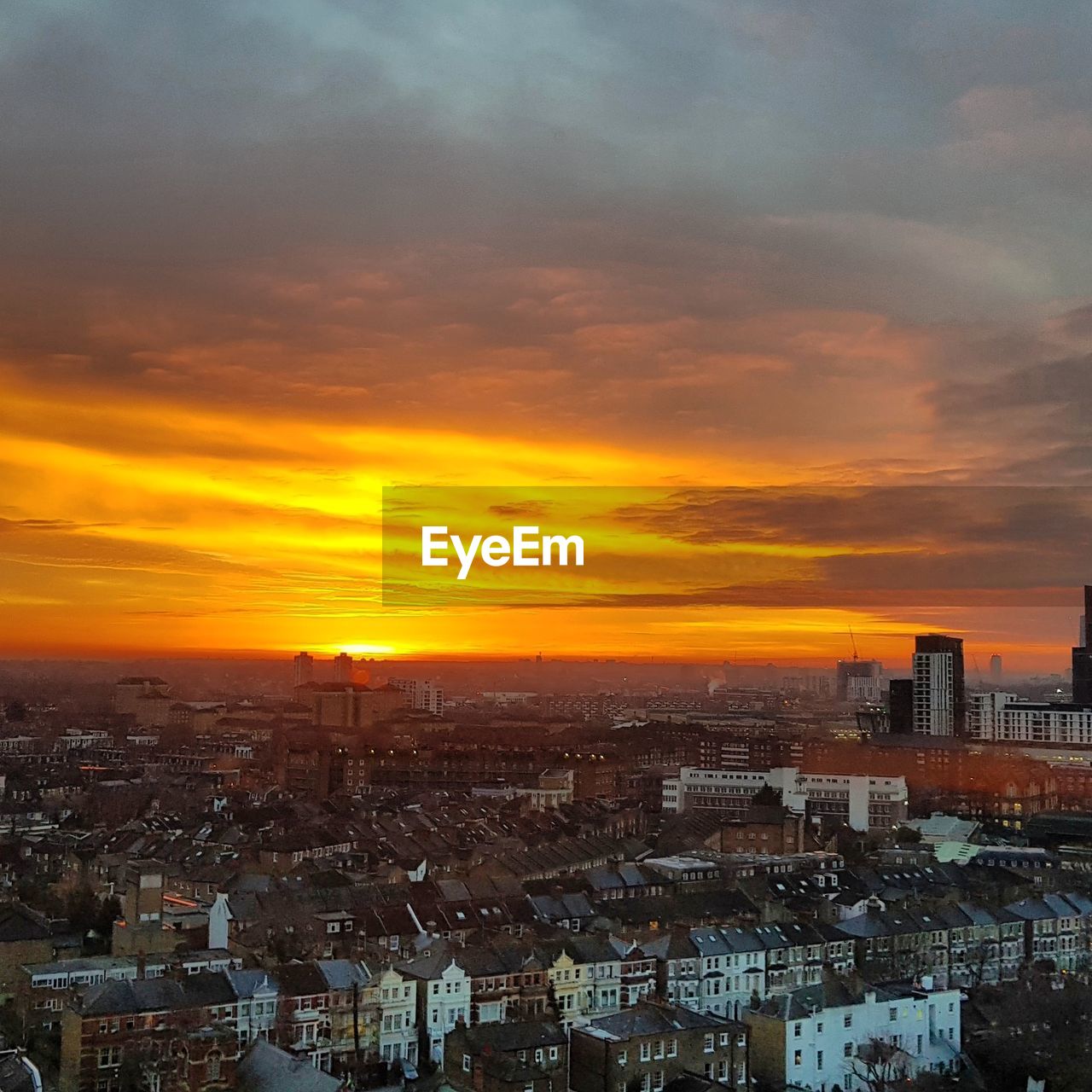 Cityscape against sky during sunset