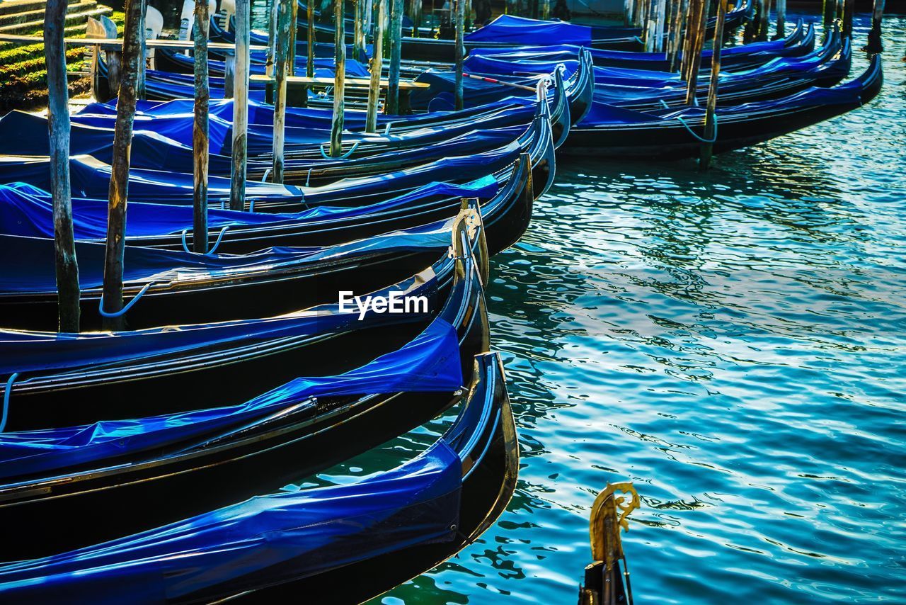 CLOSE-UP OF BOAT MOORED AT SHORE