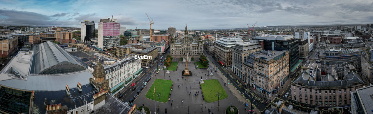 high angle view of buildings in city against sky