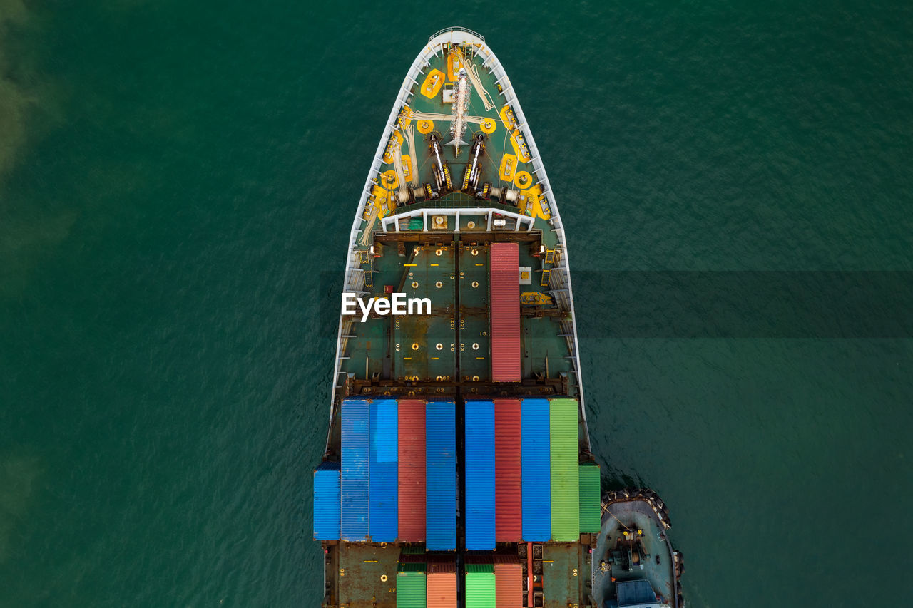 HIGH ANGLE VIEW OF FERRIS WHEEL AT SEA