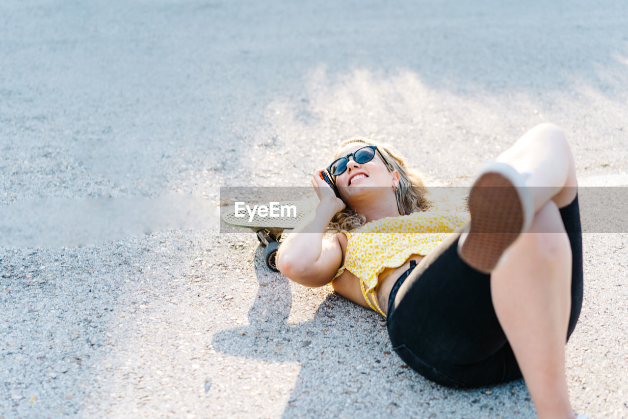 Full length of woman lying on beach