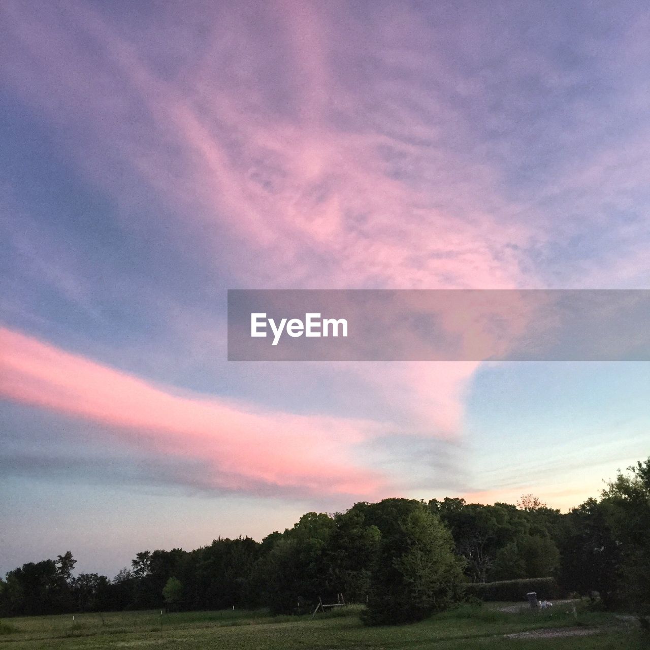 Scenic view of landscape against cloudy sky