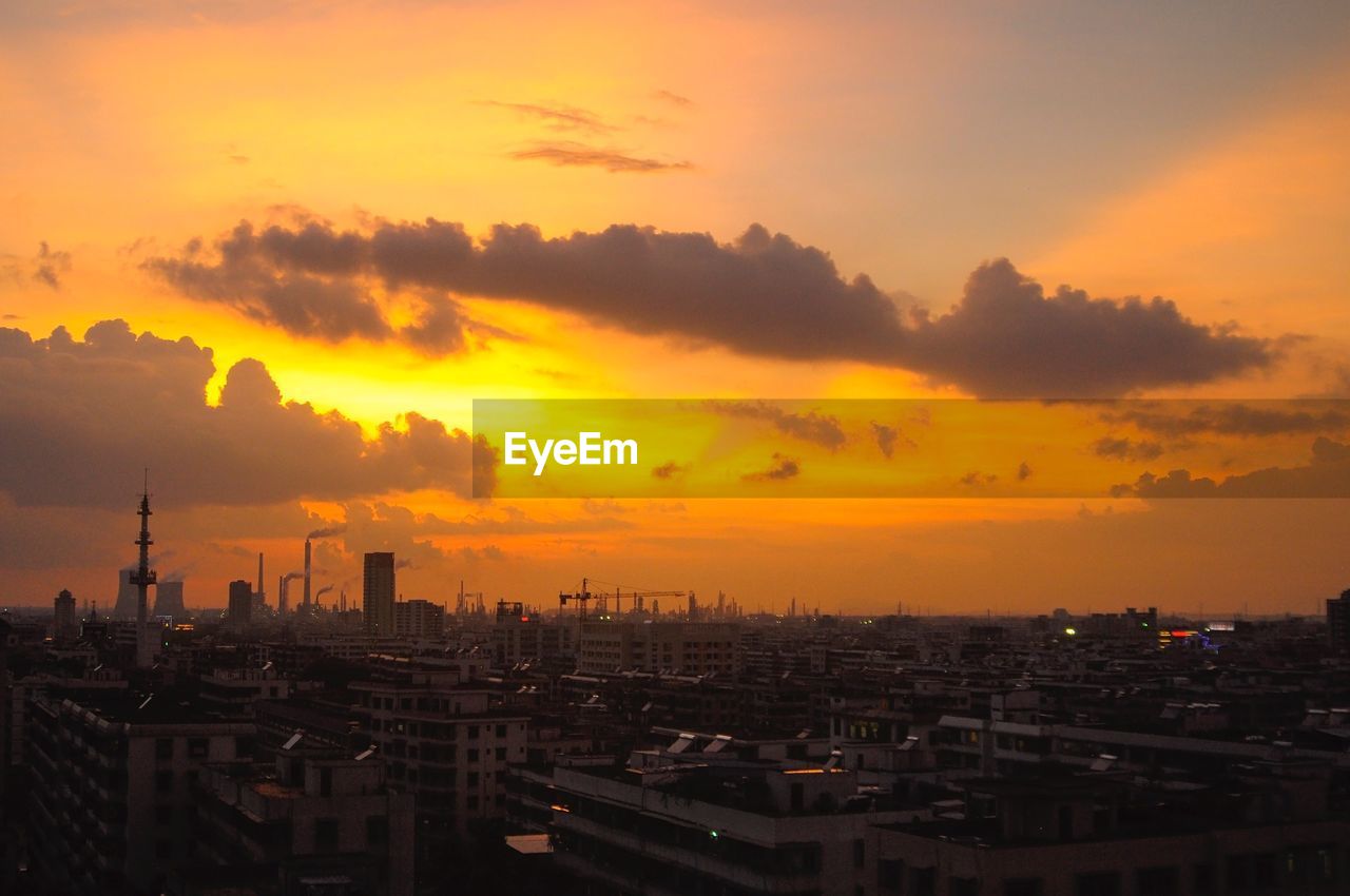 Cityscape against sky during sunset