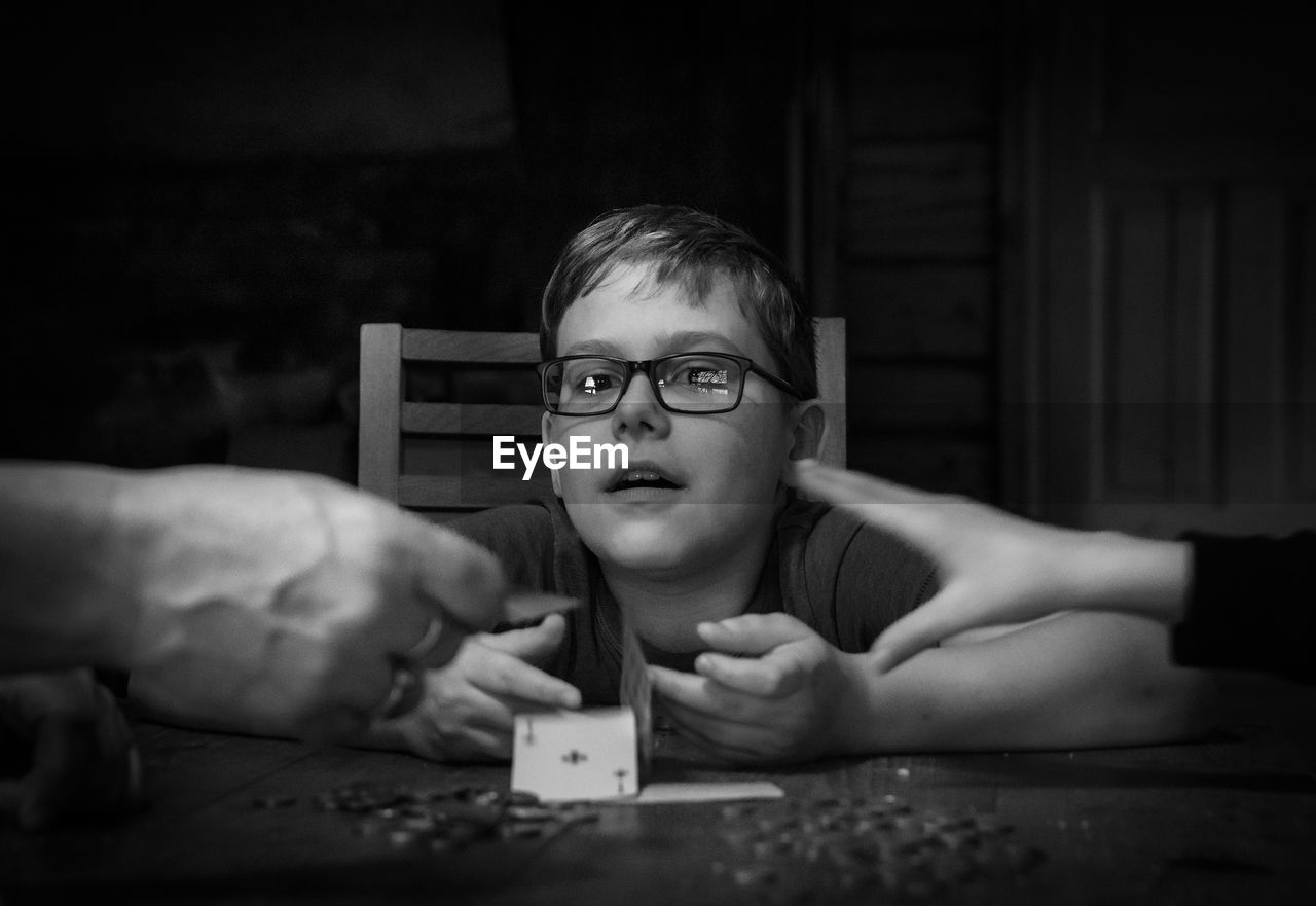 Portrait of boy playing card game