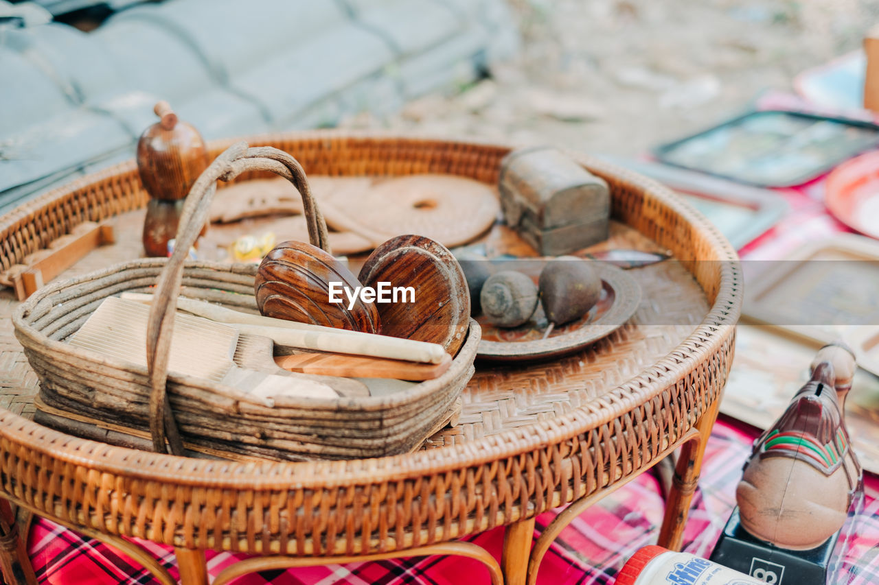 Close-up of wooden equipment on table at market stall