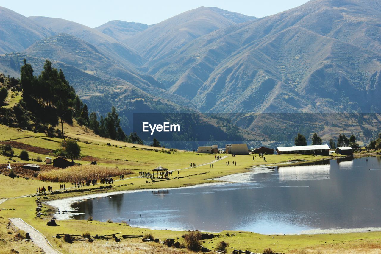 SCENIC VIEW OF LAKE AGAINST MOUNTAIN RANGE