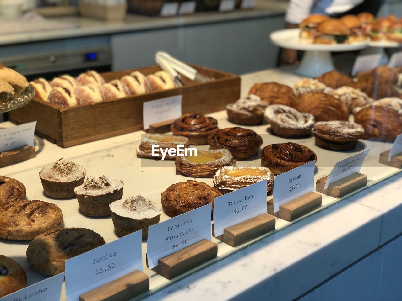 A lots of bread in the showcase in the bakery 