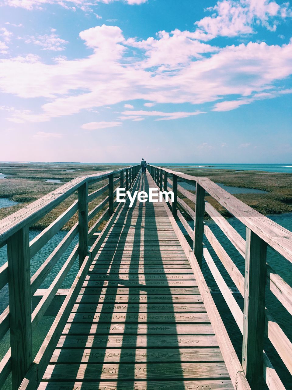 Pier over sea against sky