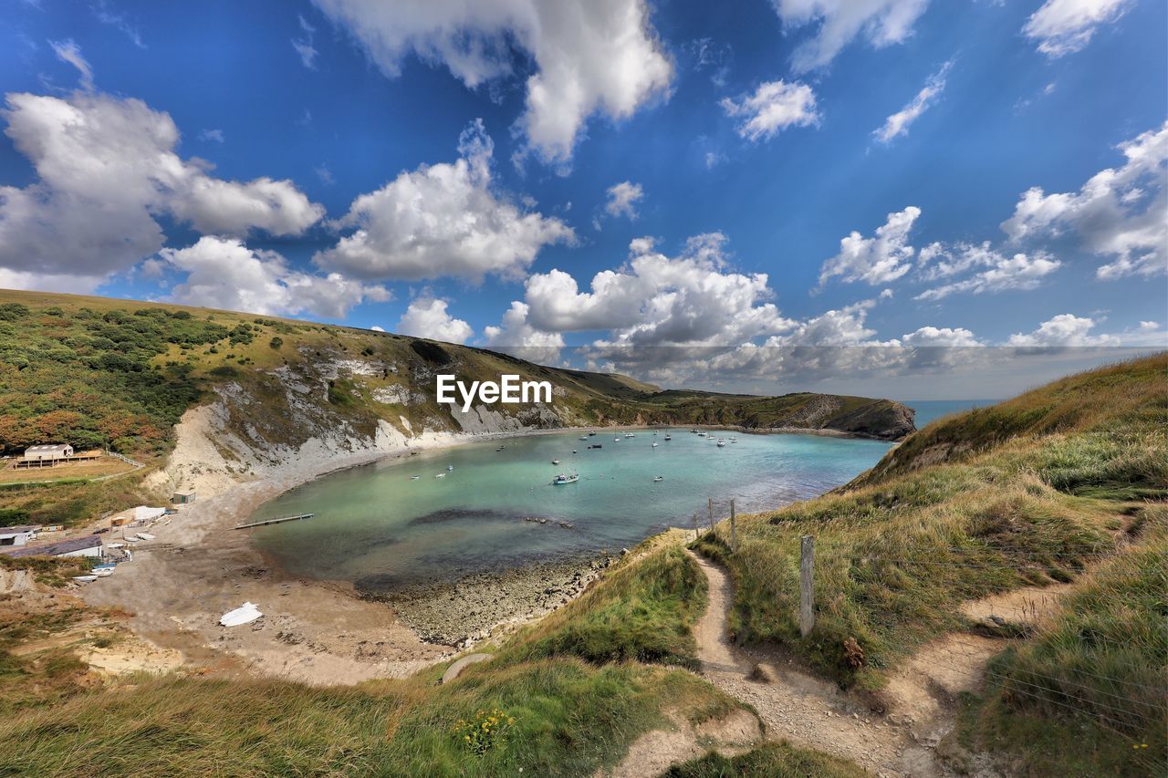 High angle view of calm sea against cloudy sky