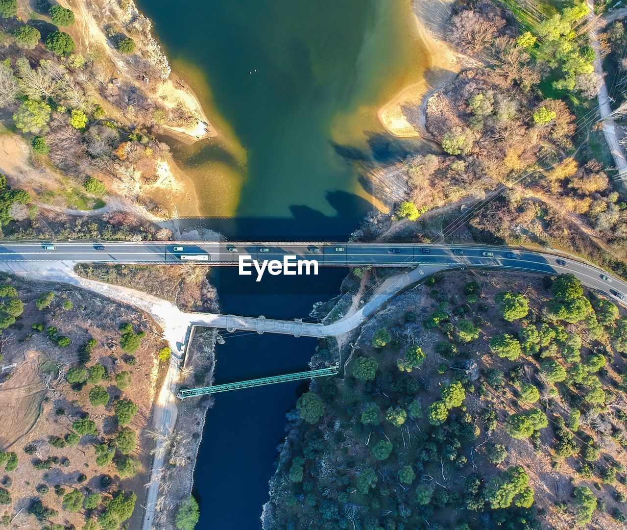 HIGH ANGLE VIEW OF SEA BY TREES
