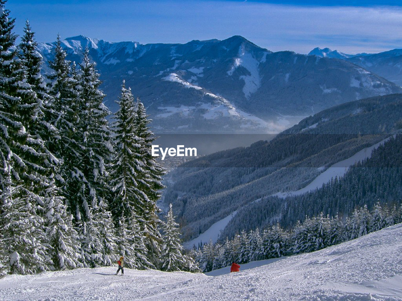 Scenic view of snow covered mountains against sky