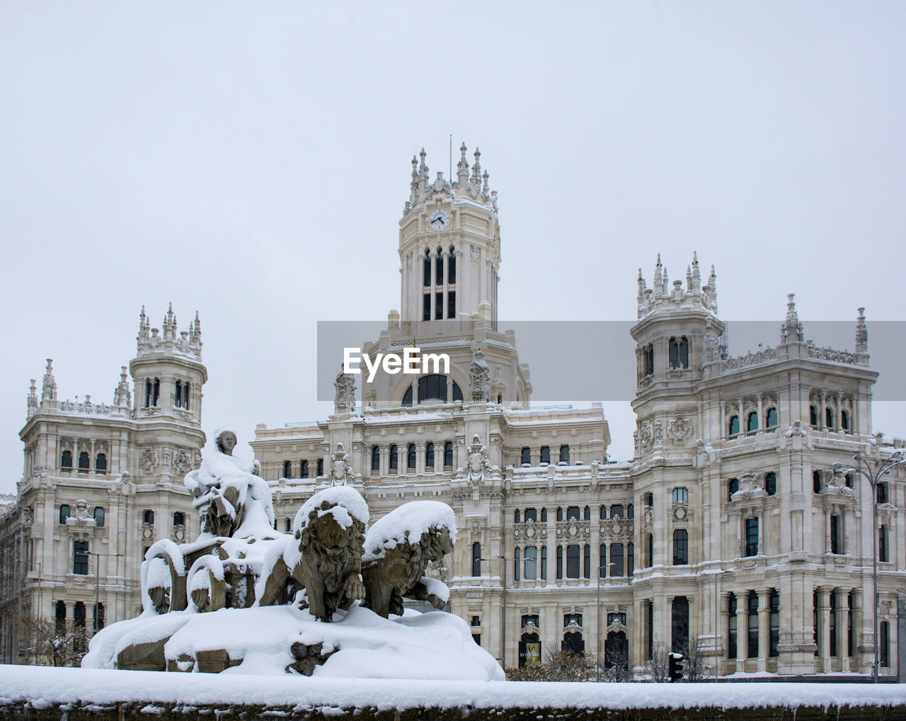 A snow covered cibeles statue during the filomena winter storm