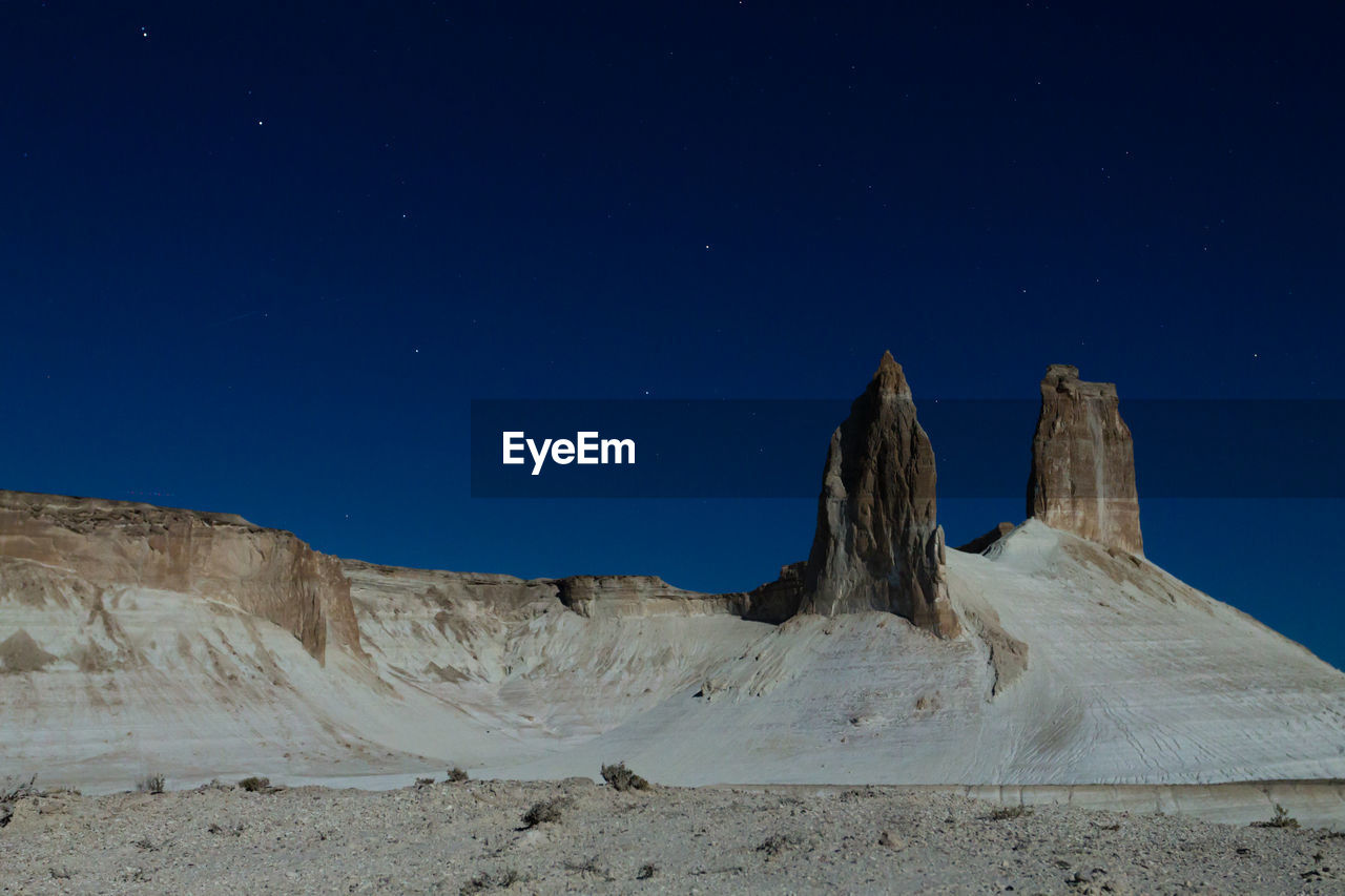 low angle view of rock formations against clear sky