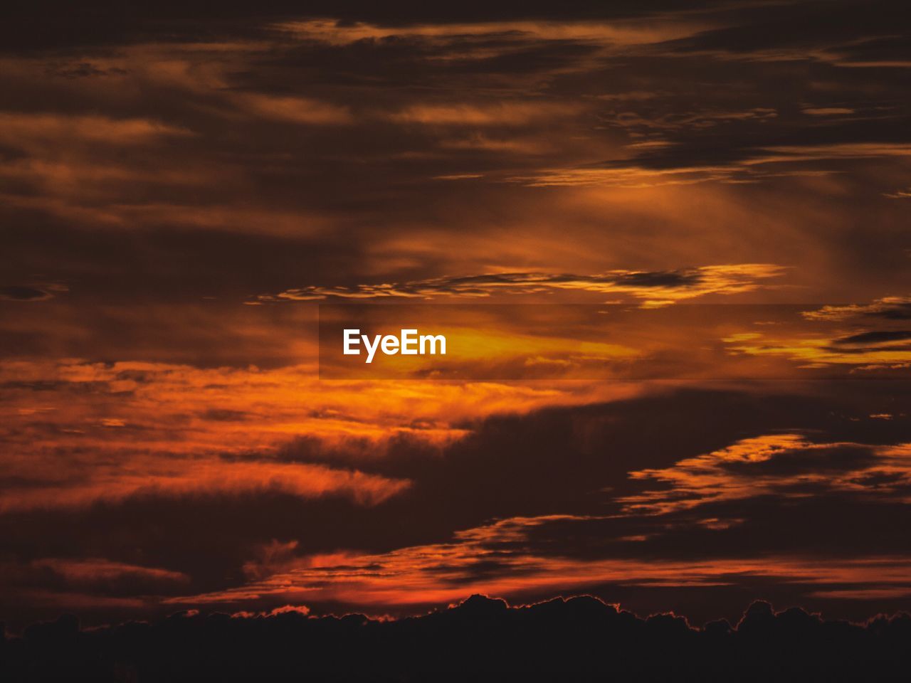 Low angle view of dramatic sky during sunset