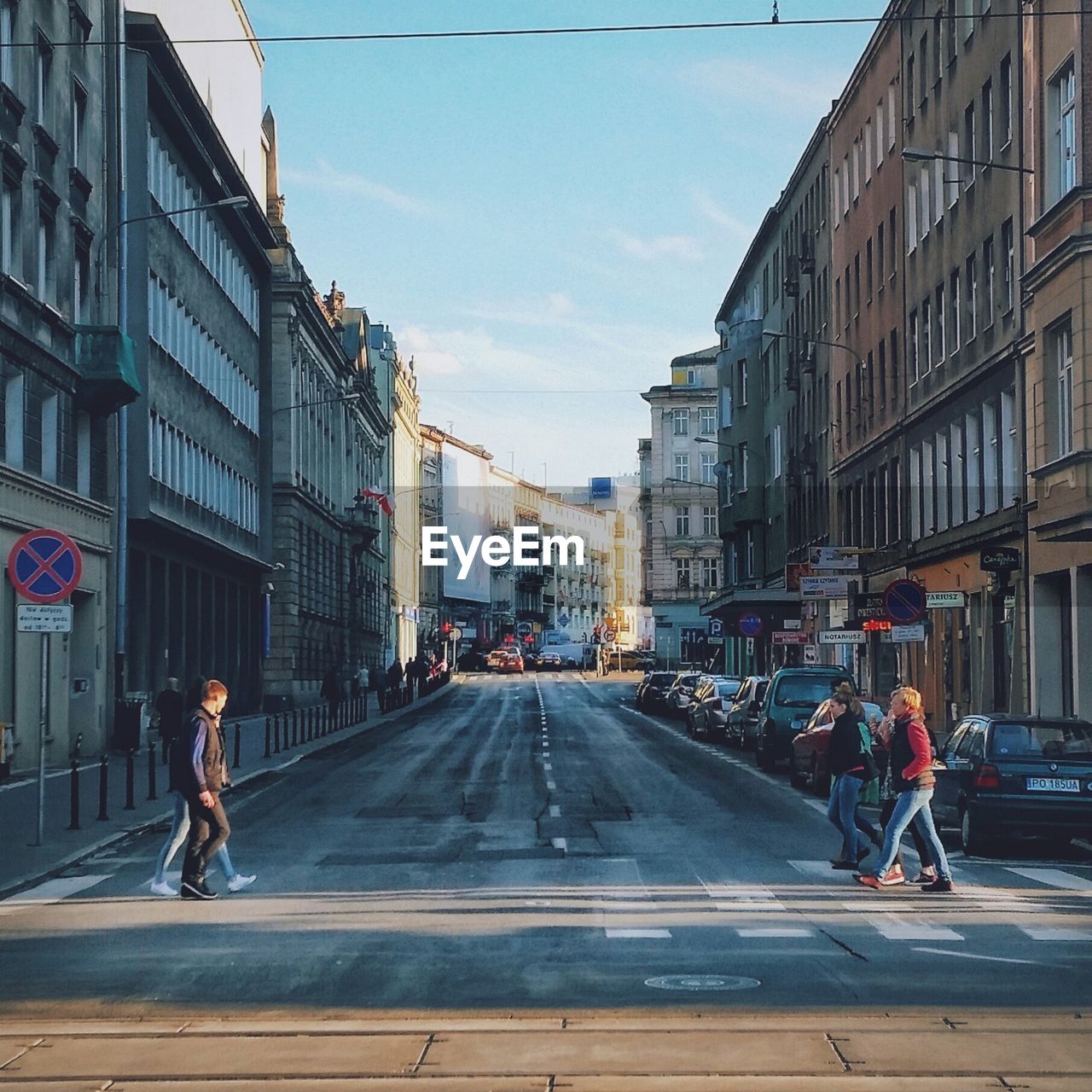 People crossing road in city