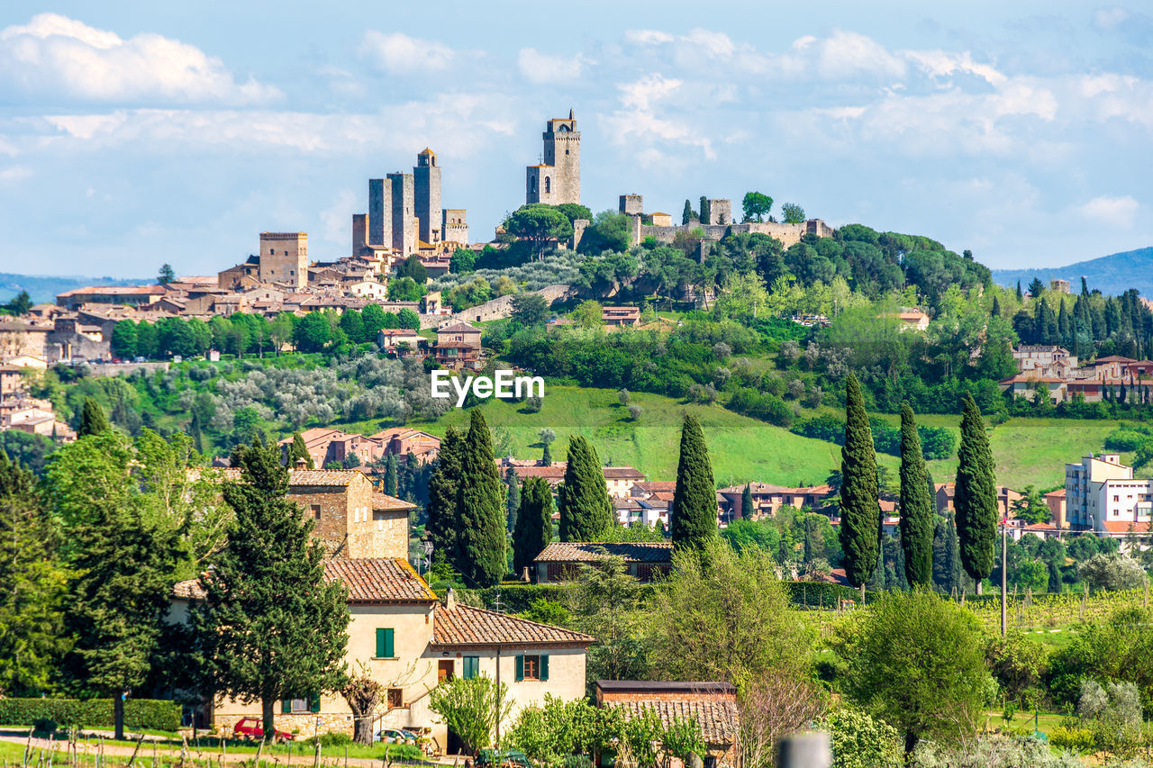 Landscape view of cultivated lands of tuscany with san gimignano and medieval towers in the distance