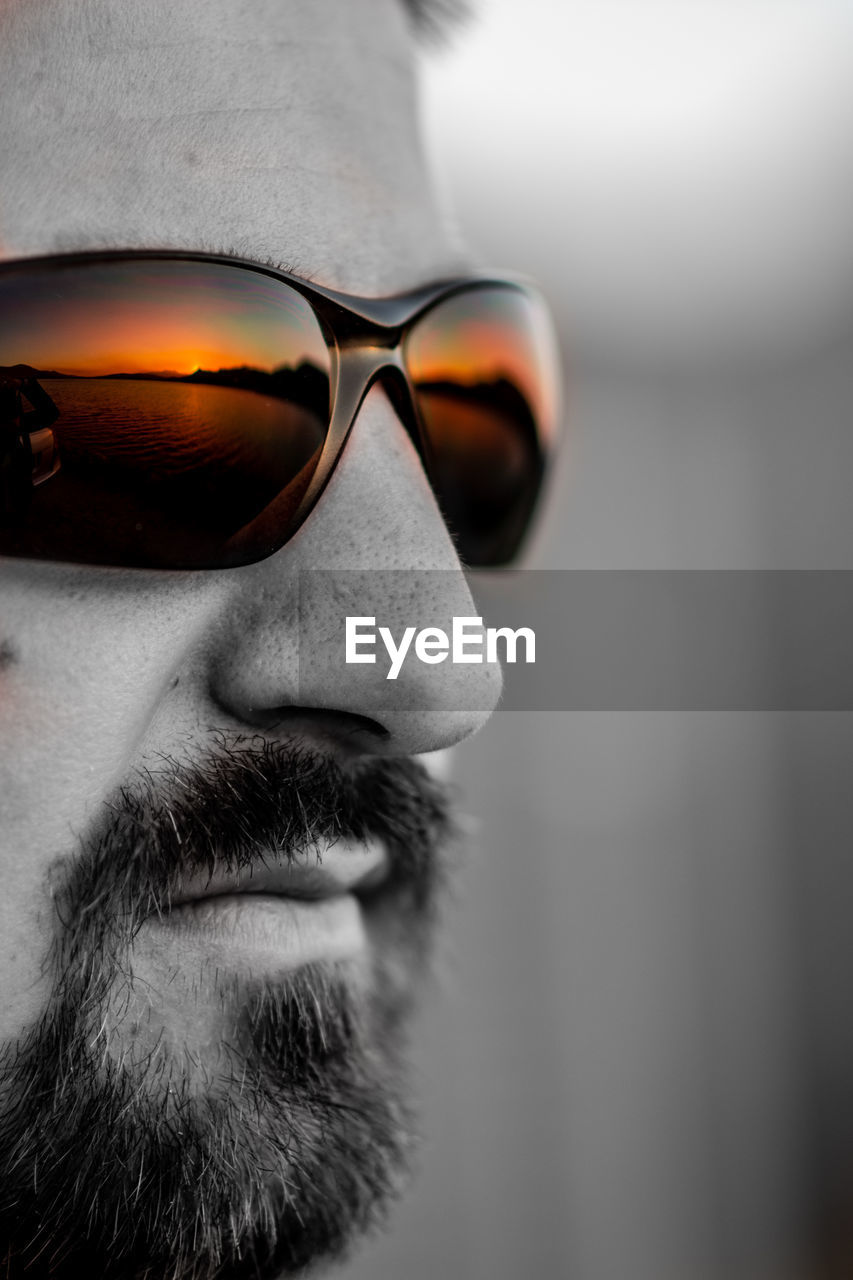 Close-up of young man wearing sunglasses