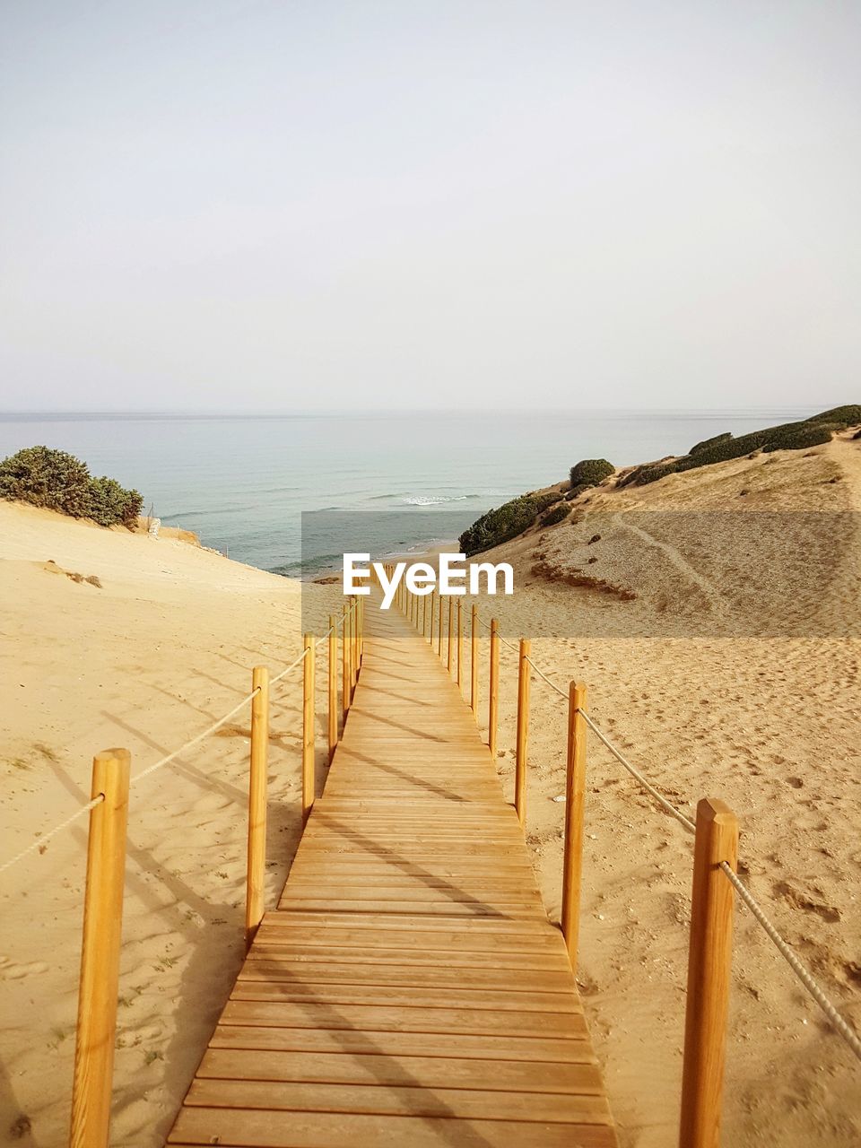 Scenic view of beach against clear sky