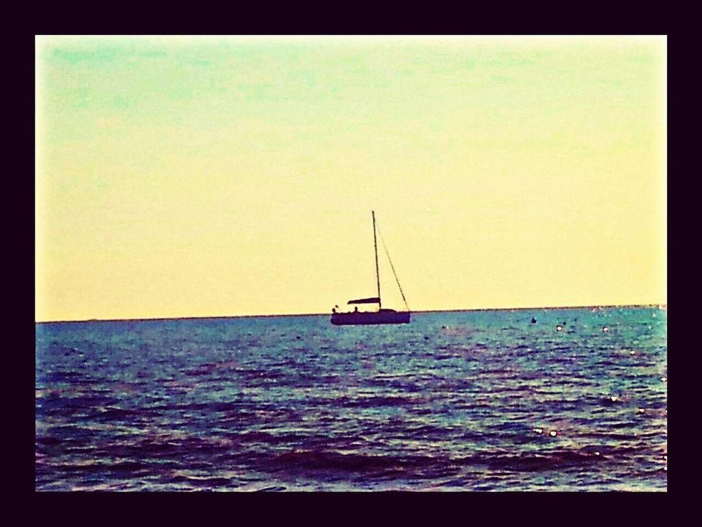 SAILBOAT SAILING IN SEA