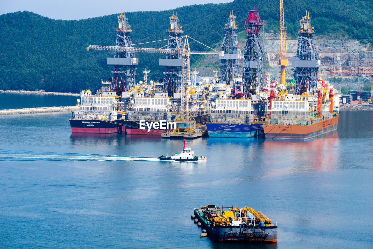 HIGH ANGLE VIEW OF SHIP ON PIER