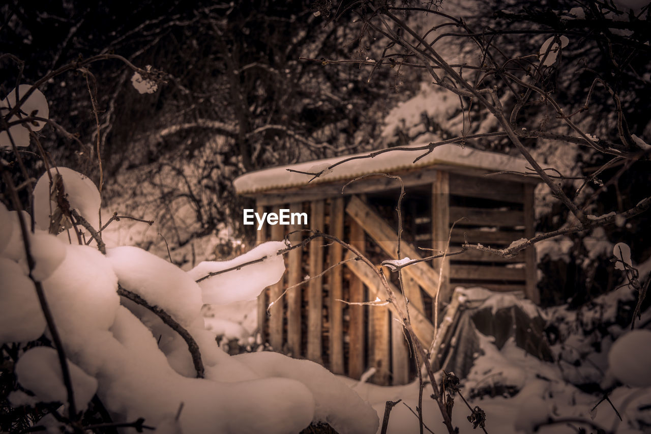 View of snow covered shed in winter