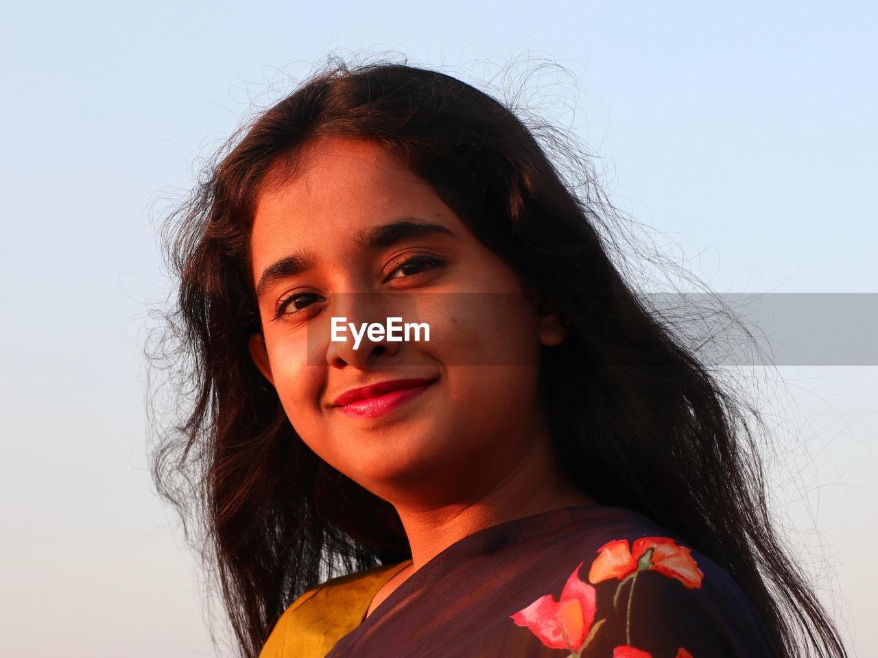 portrait, female, one person, headshot, women, teenager, red, hairstyle, smiling, long hair, sky, photo shoot, looking at camera, human face, person, happiness, nature, emotion, adult, child, young adult, human hair, black hair, copy space, portrait photography, clear sky, close-up, childhood, human head, lifestyles, brown hair, skin, front view, human eye, looking, cheerful, casual clothing, low angle view, sunlight, outdoors, studio shot