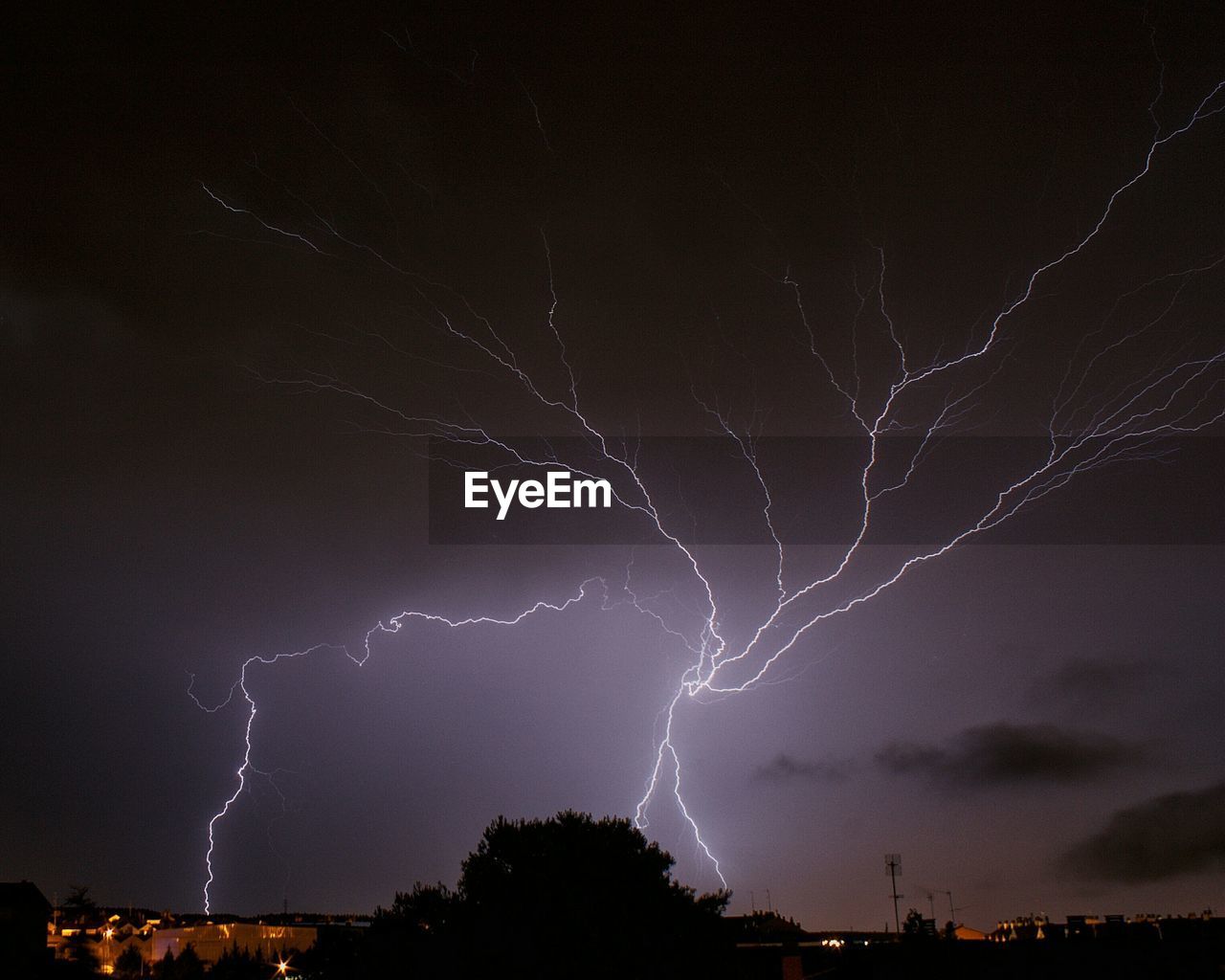 Low angle view of lightning in sky at night