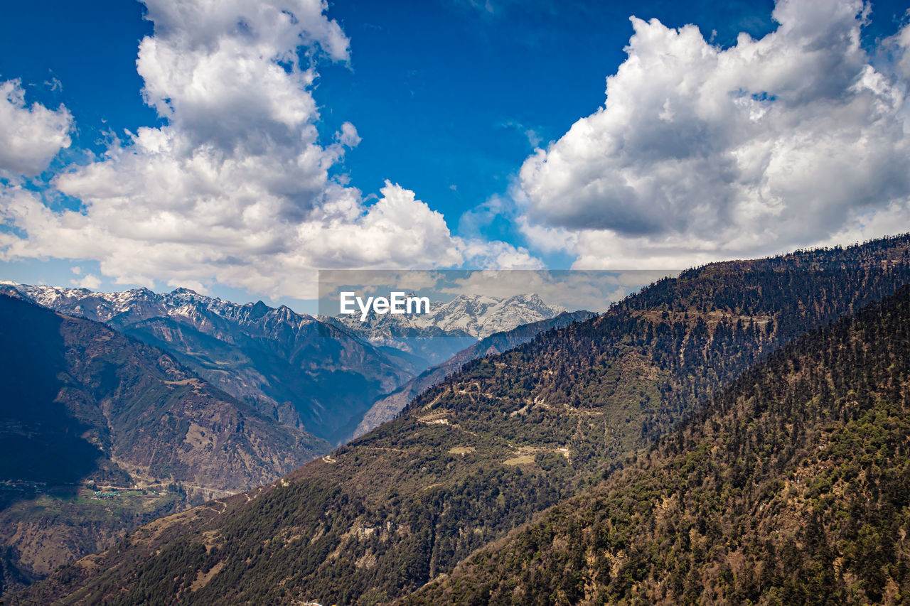 Himalaya mountain valley with bright blue sky at day from hilltop