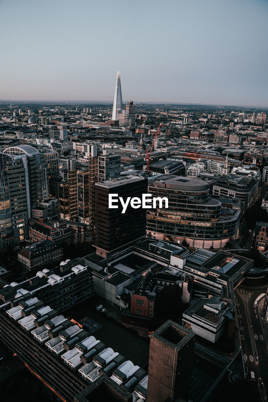 Aerial view of city buildings against sky